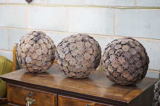 A pine cone tree ornament, height 156cm and three pine cone ball ornaments